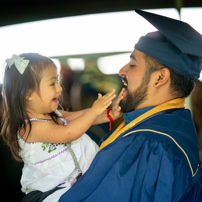Student and child at graduation