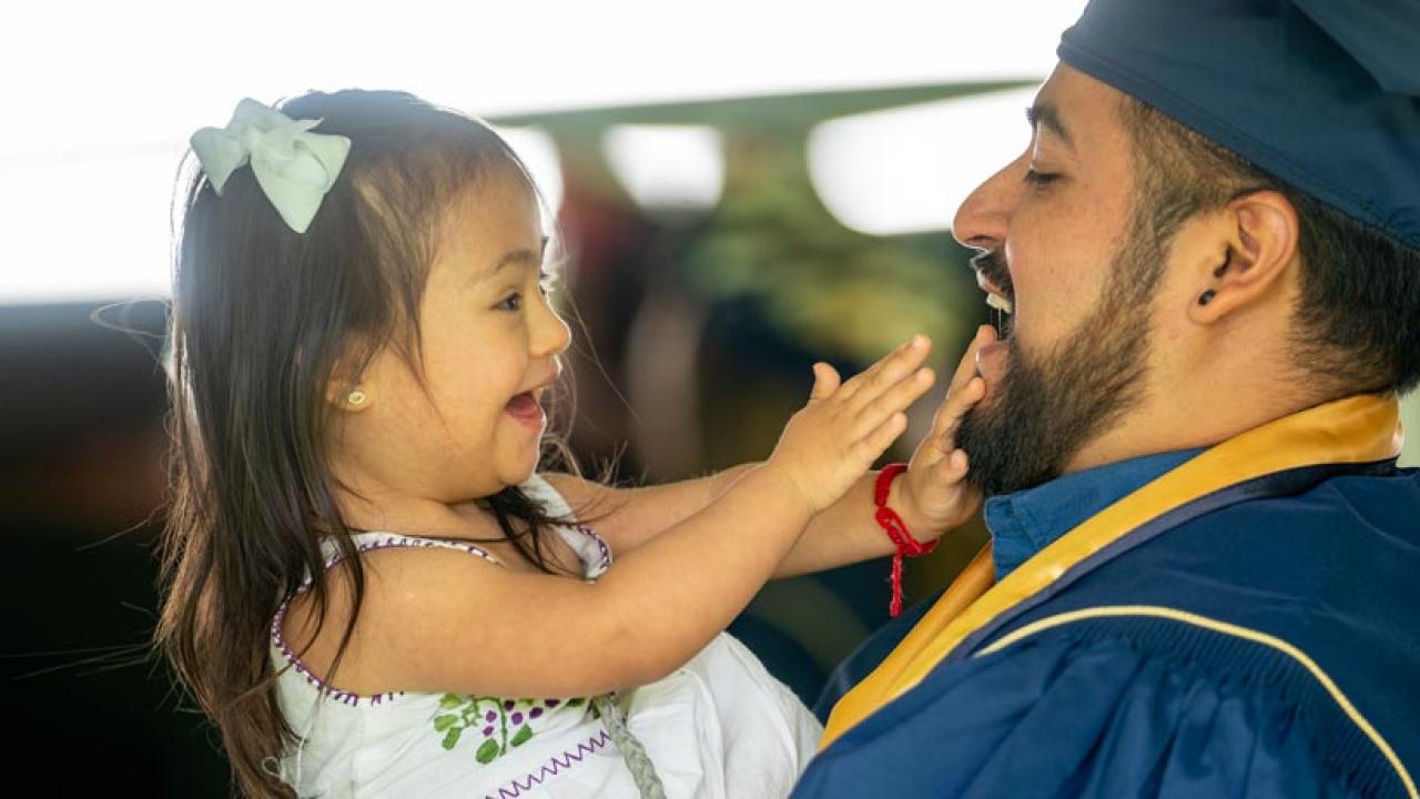 Student and child at graduation